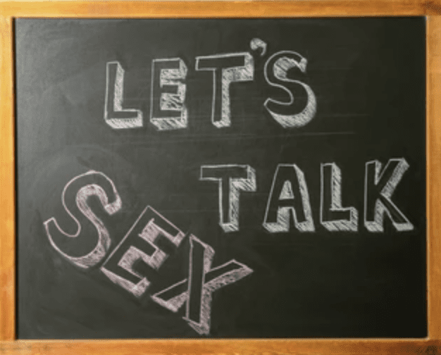 Chalkboard with the words “Let’s Talk Sex” written in chalk to represent conversations about intimacy in therapy.